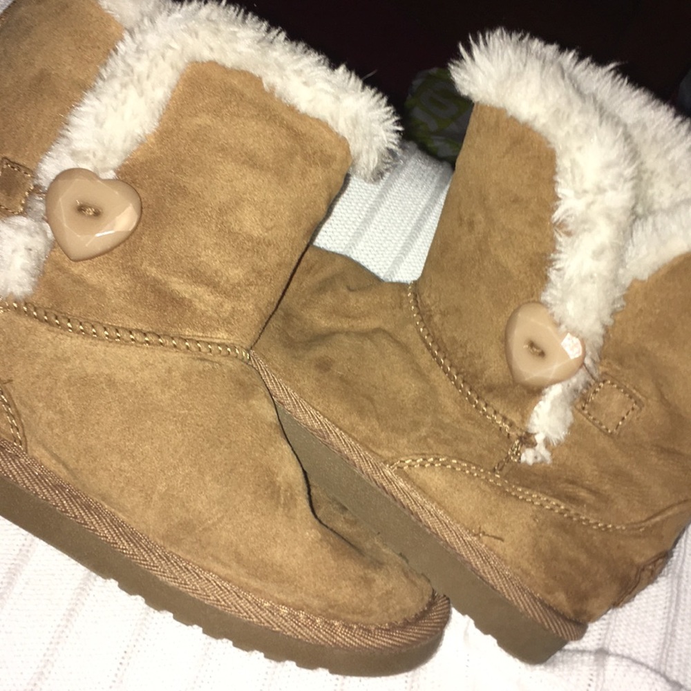 brown and white fuzzy boots
